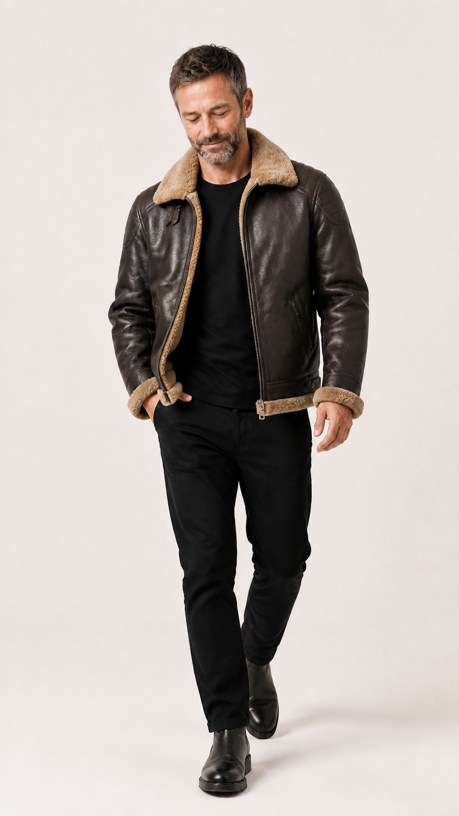 Full-length walking shot of the brown shearling flight jacket — British model